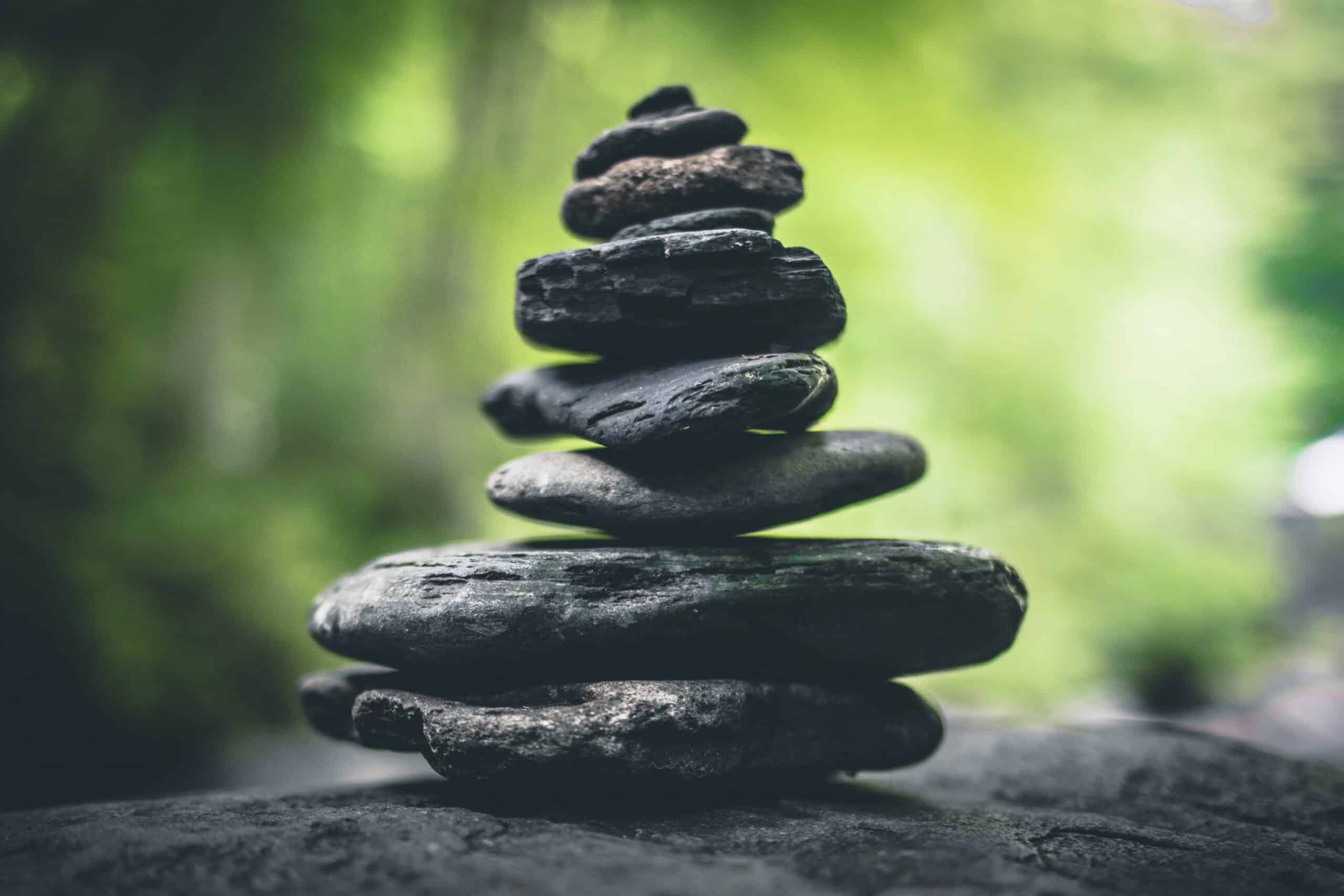 black stackd stones green background TEAMCare Behavioral Health